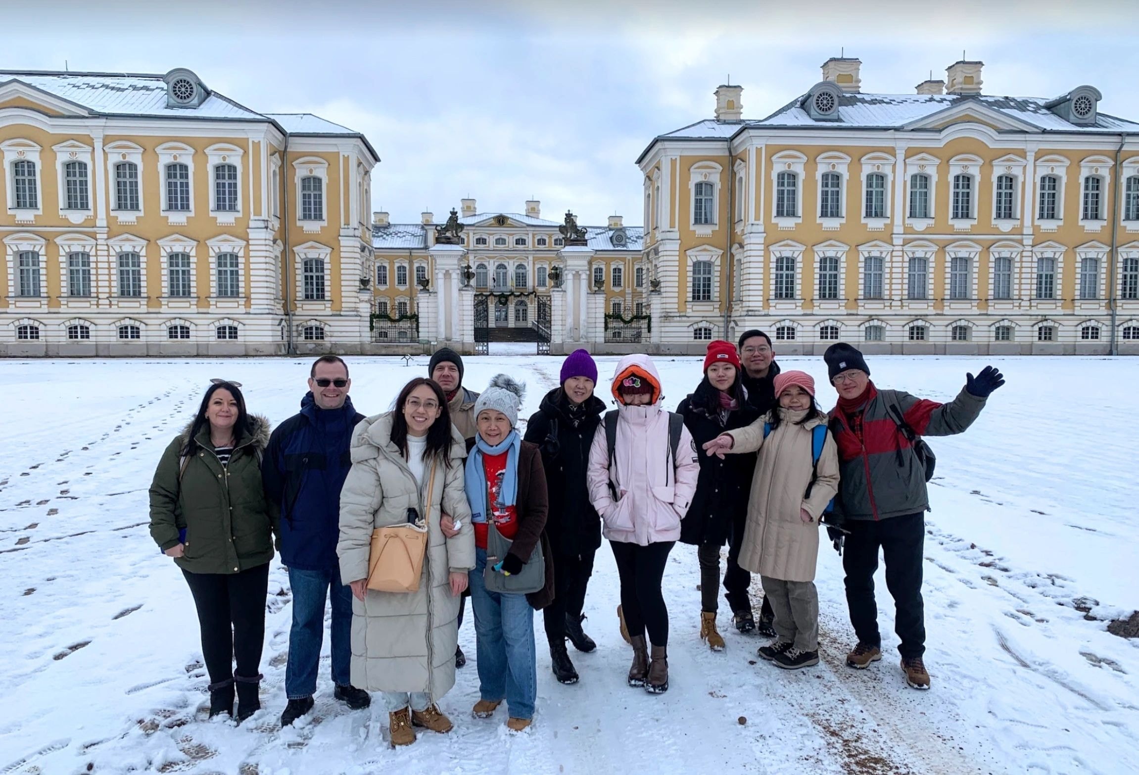 Group at snowy palace square Latvia